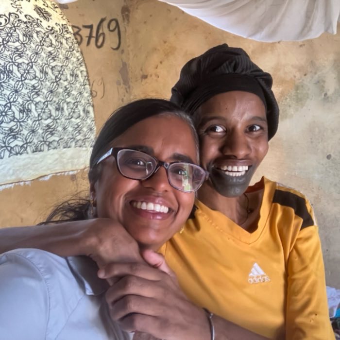 Suja Brane laughing with a Senegalese friend